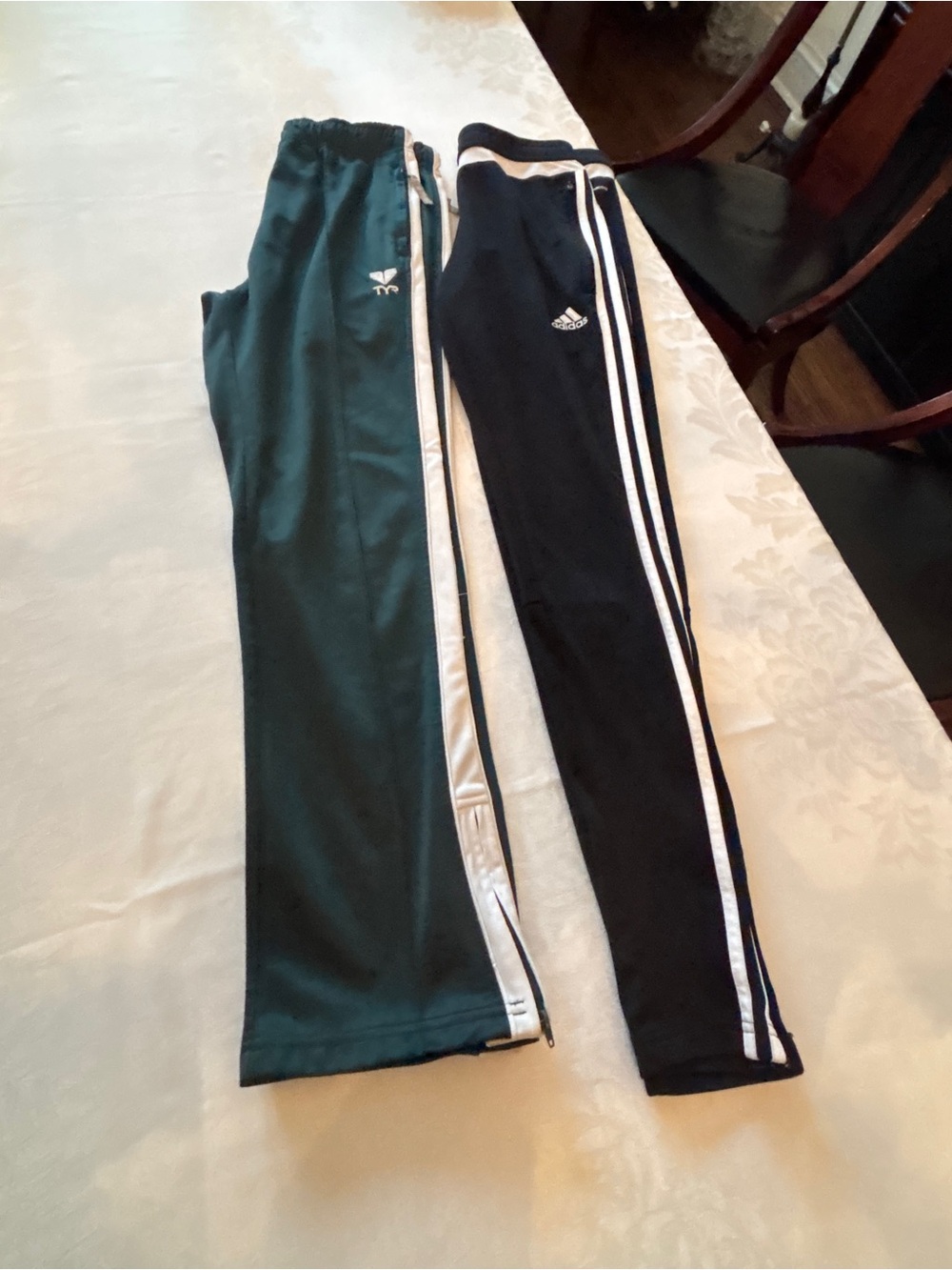 Bundle of Adidas and TYR track pants in black and dark green